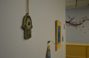 The wall of the then-yet-to-be-opened Takoma Wellness Center featuring hamsas, a traditional Jewish symbol. Photo by Zach C. Cohen. 
